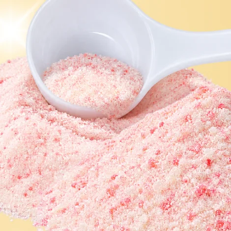 Serbuk Beauty Dust berwarna pink dengan sudu penyukat